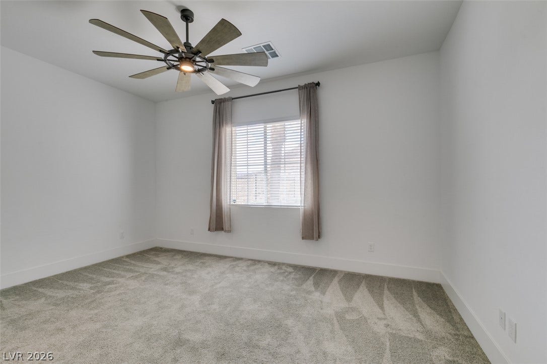 11288 Rebel Dome Court, Las Vegas, NV 89141 Soft carpeting underfoot provides a comfortable base in this versatile room.