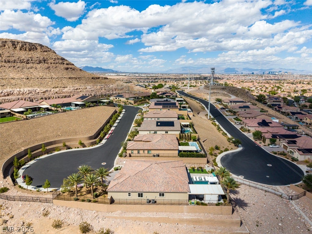 11288 Rebel Dome Court, Las Vegas, NV 89141 Scenic mountain vistas surround this tranquil desert neighborhood under a bright blue sky.