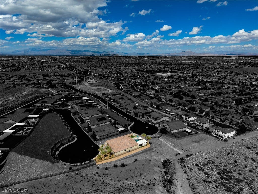 11288 Rebel Dome Court, Las Vegas, NV 89141 An aerial perspective captures this desert property situated along a scenic ridge with city views.