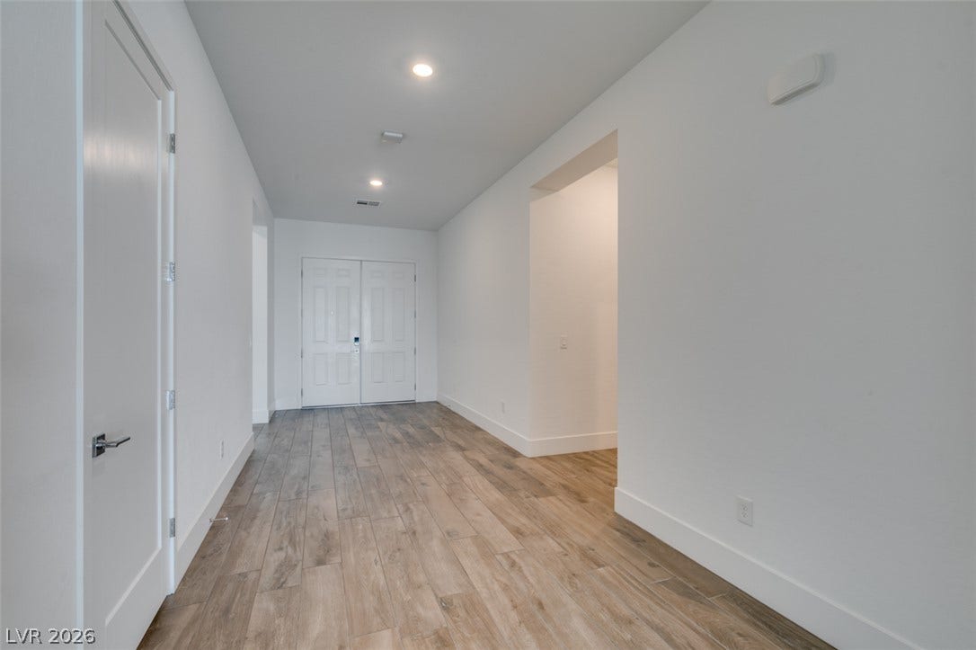 11288 Rebel Dome Court, Las Vegas, NV 89141 Clean lines and durable wood-look flooring define this welcoming home entryway.