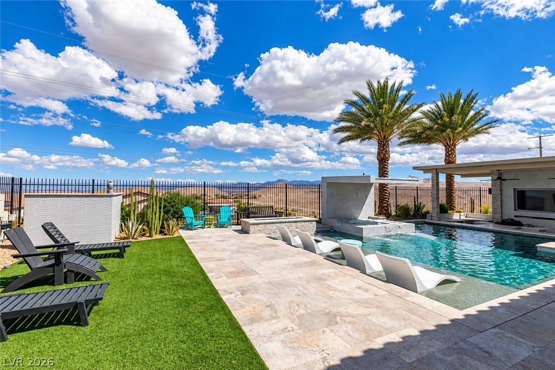 11288 Rebel Dome Court, Las Vegas, NV 89141 A sparkling pool highlights this desert oasis with stone pavers and panoramic mountain views.