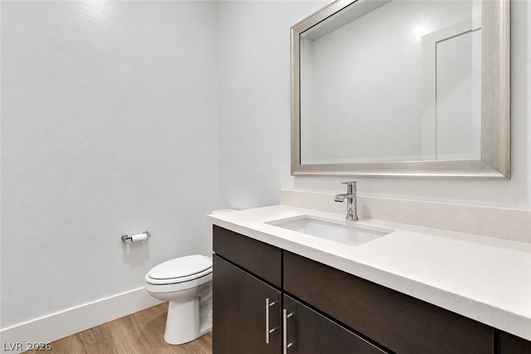 11288 Rebel Dome Court, Las Vegas, NV 89141 A modern vanity with stone counters complements the clean lines of this bathroom.