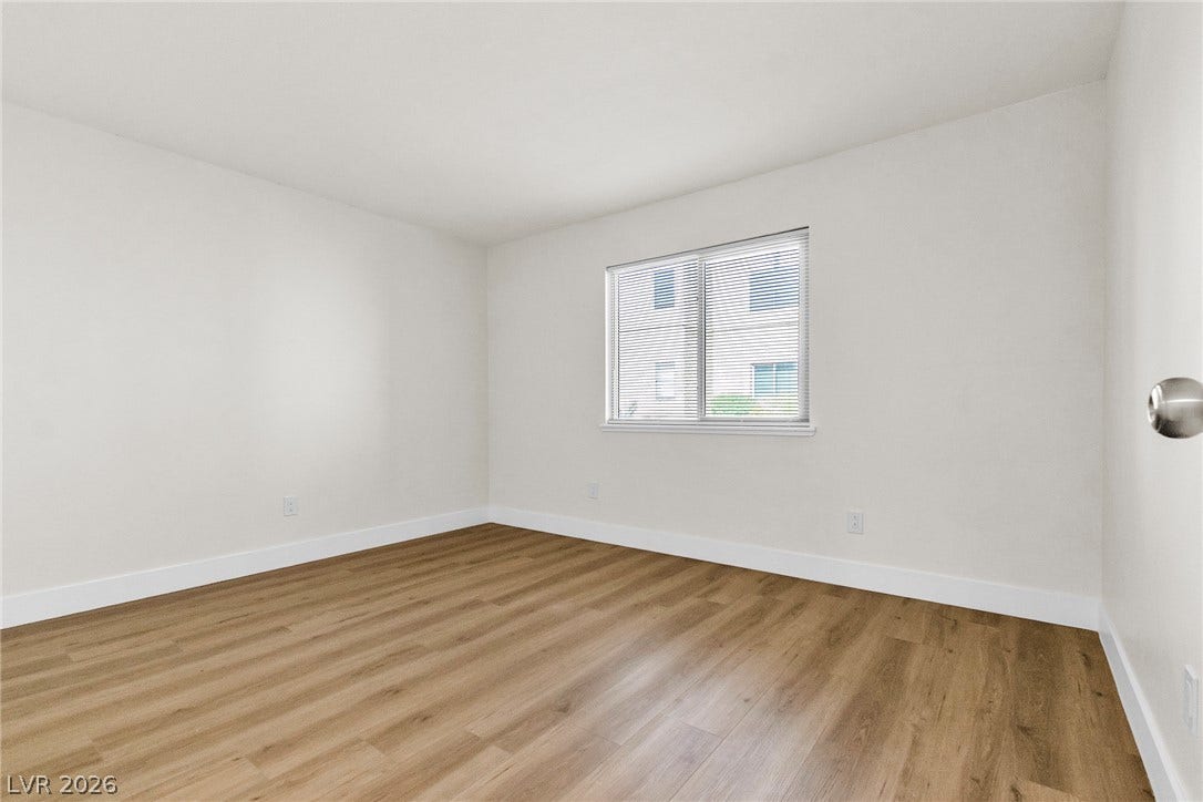 Smooth wood-look flooring and clean lines define this versatile secondary space.