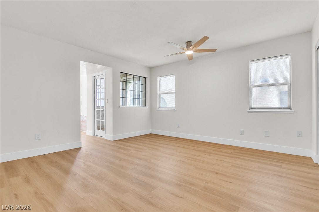 Gleaming wood floors anchor a flexible living space designed for contemporary comfort.