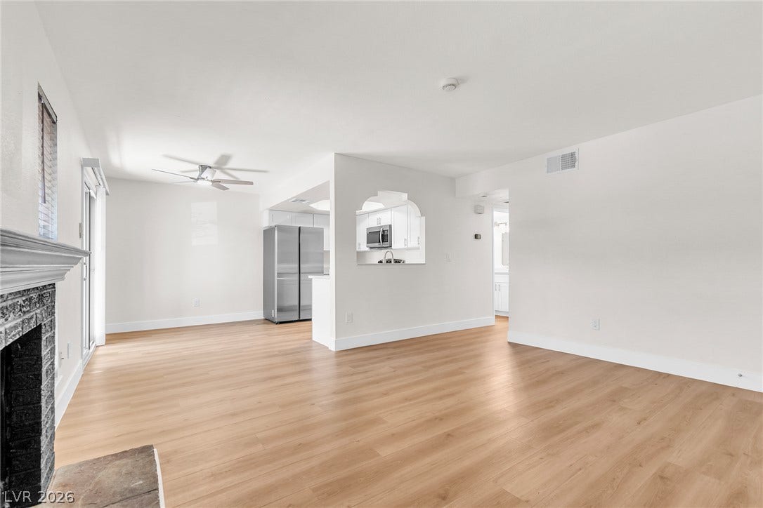 Gleaming wood floors anchor a versatile open layout connecting the main living areas seamlessly.