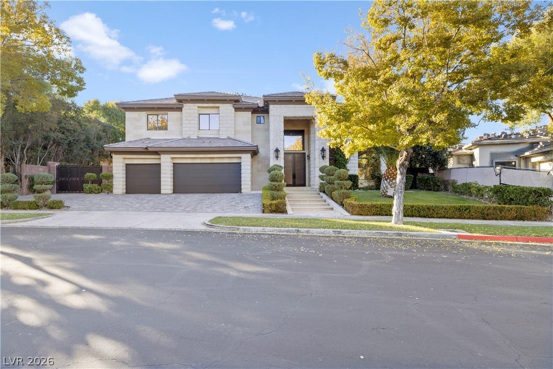 9624 Grand Isle Lane, Las Vegas, NV 89144 An elegant stone facade and paved driveway establish a commanding street presence.