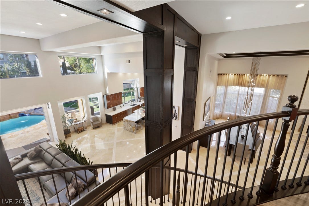 9624 Grand Isle Lane, Las Vegas, NV 89144 Polished tile flooring and architectural wood detailing define this airy, light-filled multi-level design.