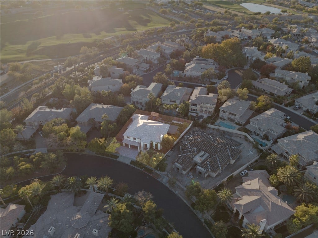 9624 Grand Isle Lane, Las Vegas, NV 89144 An aerial perspective captures this master-planned neighborhood surrounded by rolling green hills.