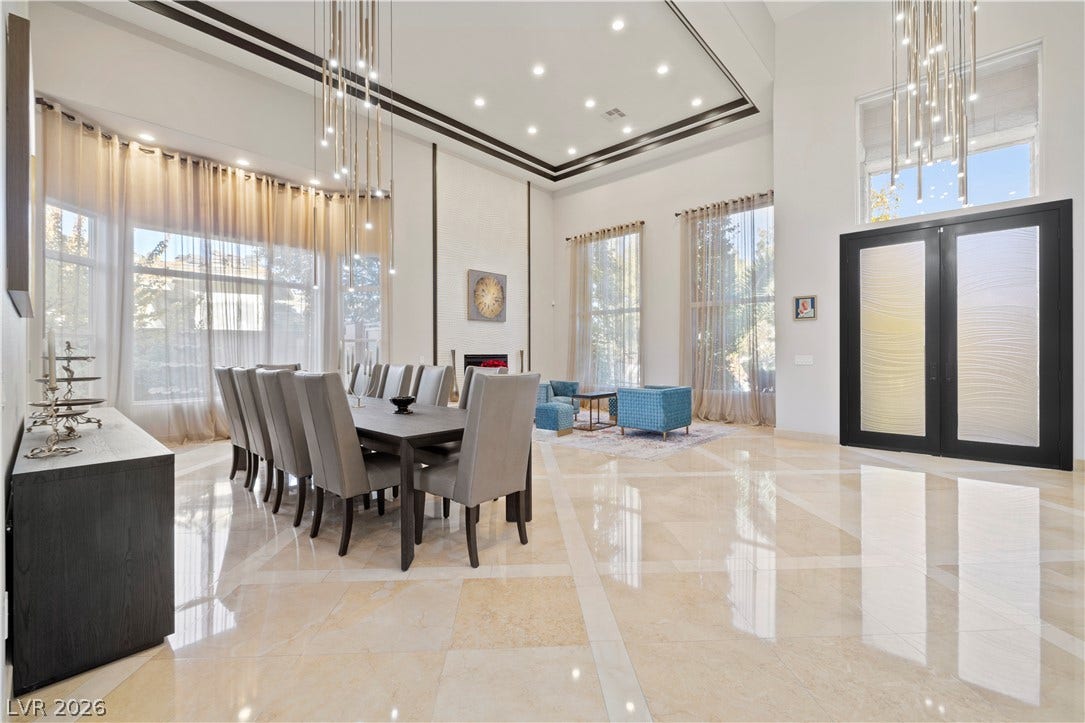 9624 Grand Isle Lane, Las Vegas, NV 89144 Polished tile flooring and soarings ceilings create an impressive dining and living space.