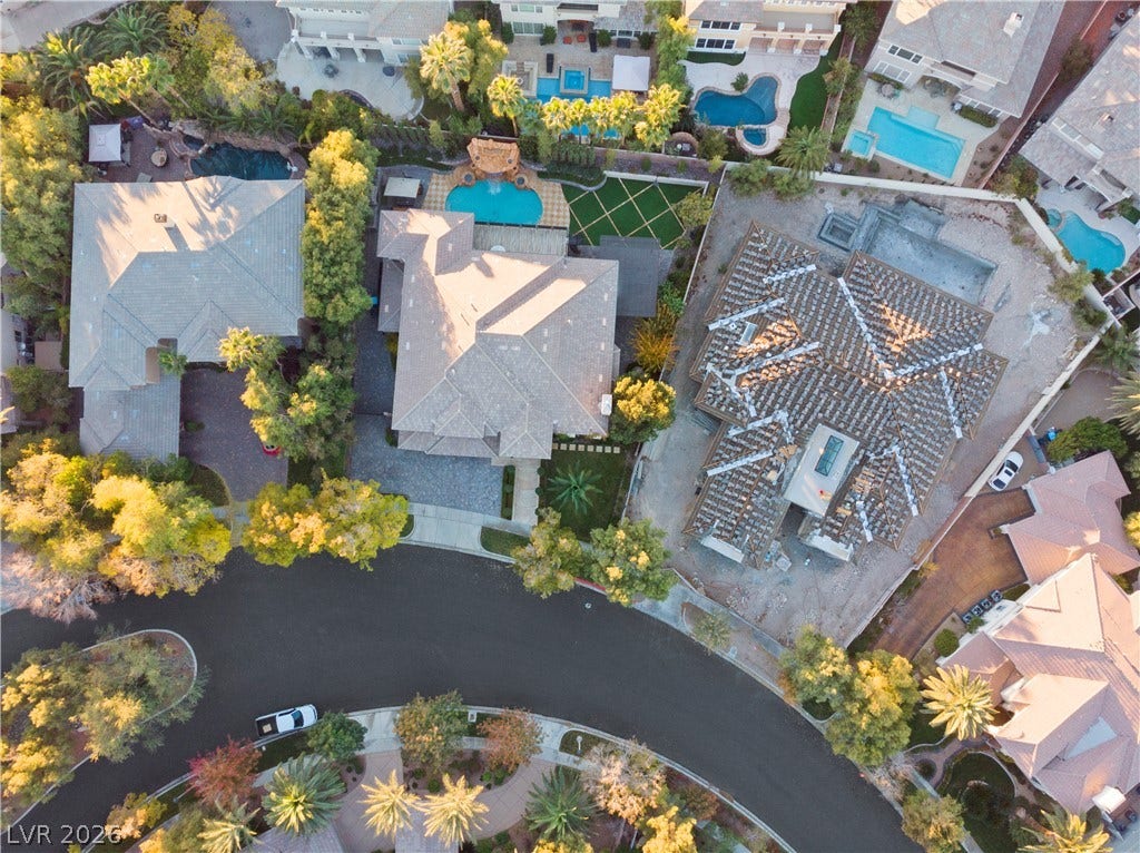 9624 Grand Isle Lane, Las Vegas, NV 89144 An aerial perspective showcases the properties and surrounding neighborhood from high above.