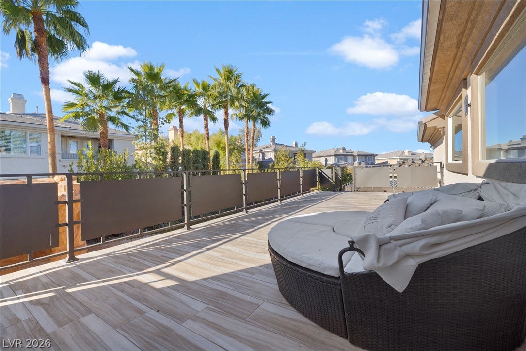 9624 Grand Isle Lane, Las Vegas, NV 89144 Tiled flooring and sturdy metal railings define this elevated outdoor living space.