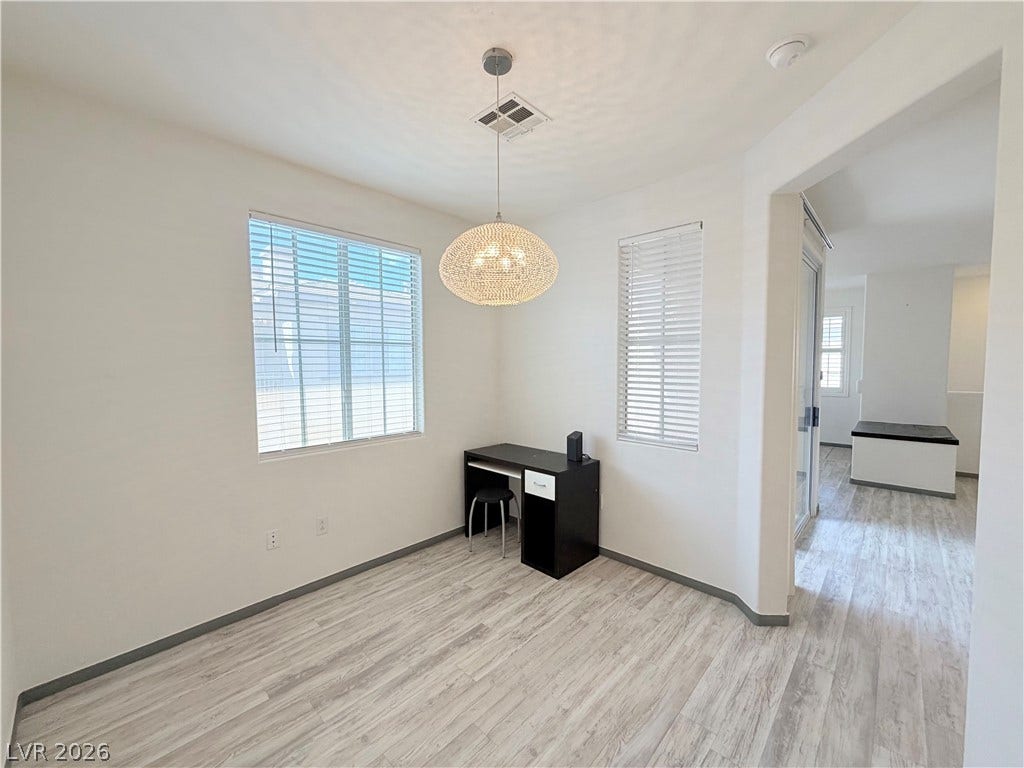 10221 Deerfield Beach Avenue, #202, Las Vegas, NV 89129 Clean lines and light-toned plank flooring define this versatile interior space.