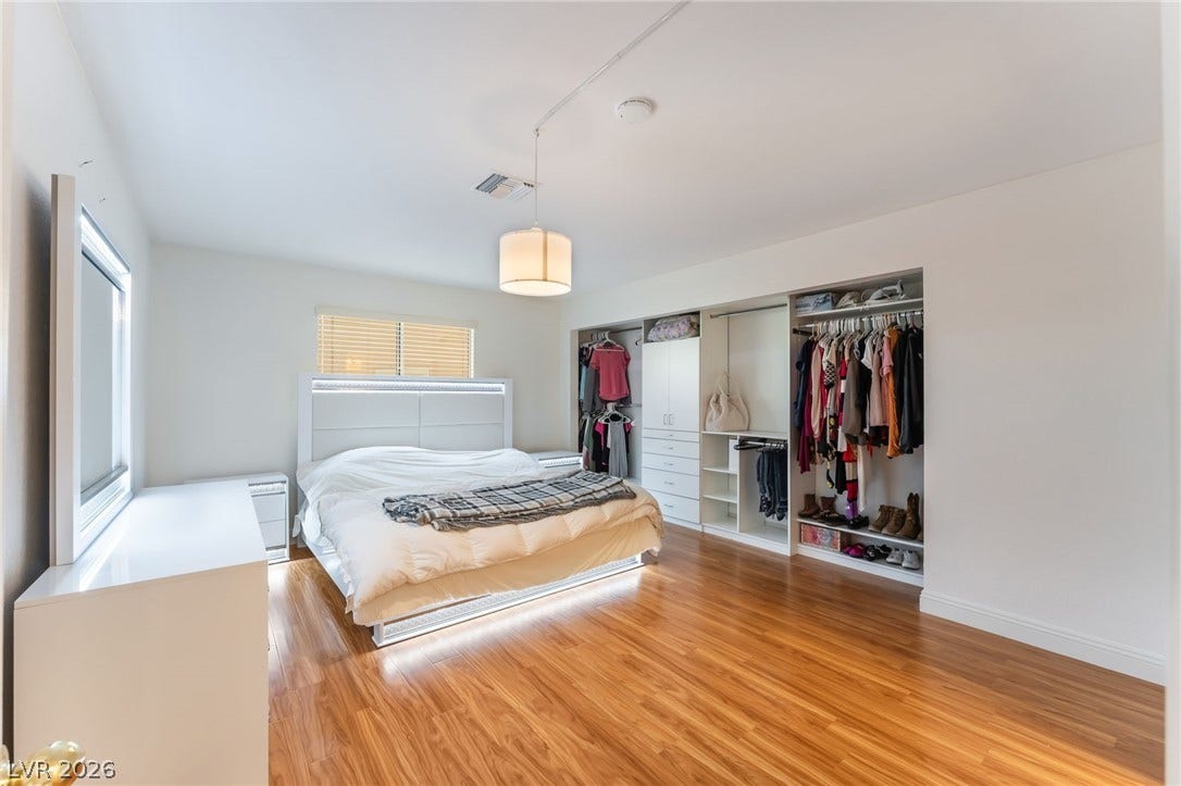 1305 Markwood Circle, #102, Las Vegas, NV 89128 Bedroom featuring light wood-style floors and baseboards