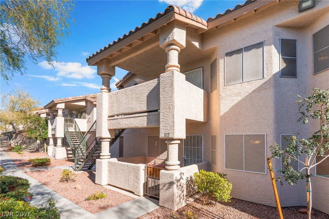 1305 Markwood Circle, #102, Las Vegas, NV 89128 View of building exterior featuring stairs