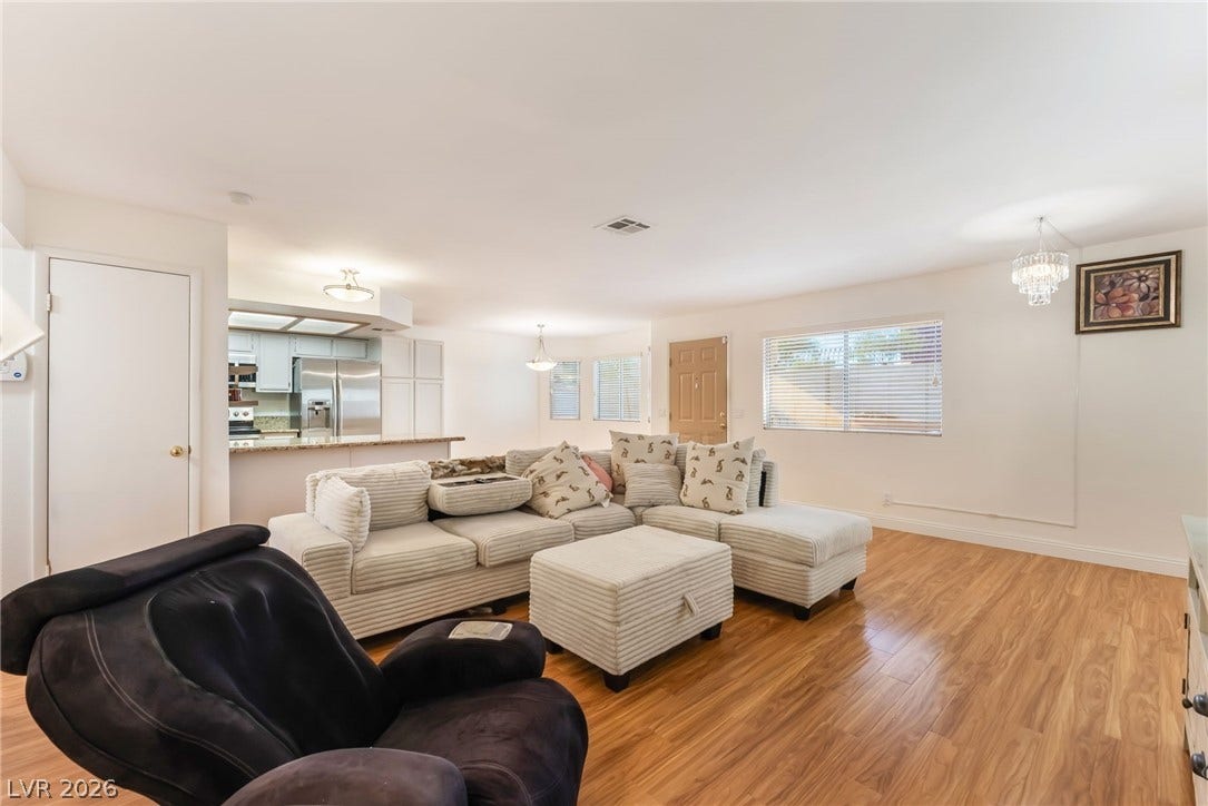 1305 Markwood Circle, #102, Las Vegas, NV 89128 Living room with light wood-style floors and suspended lighting