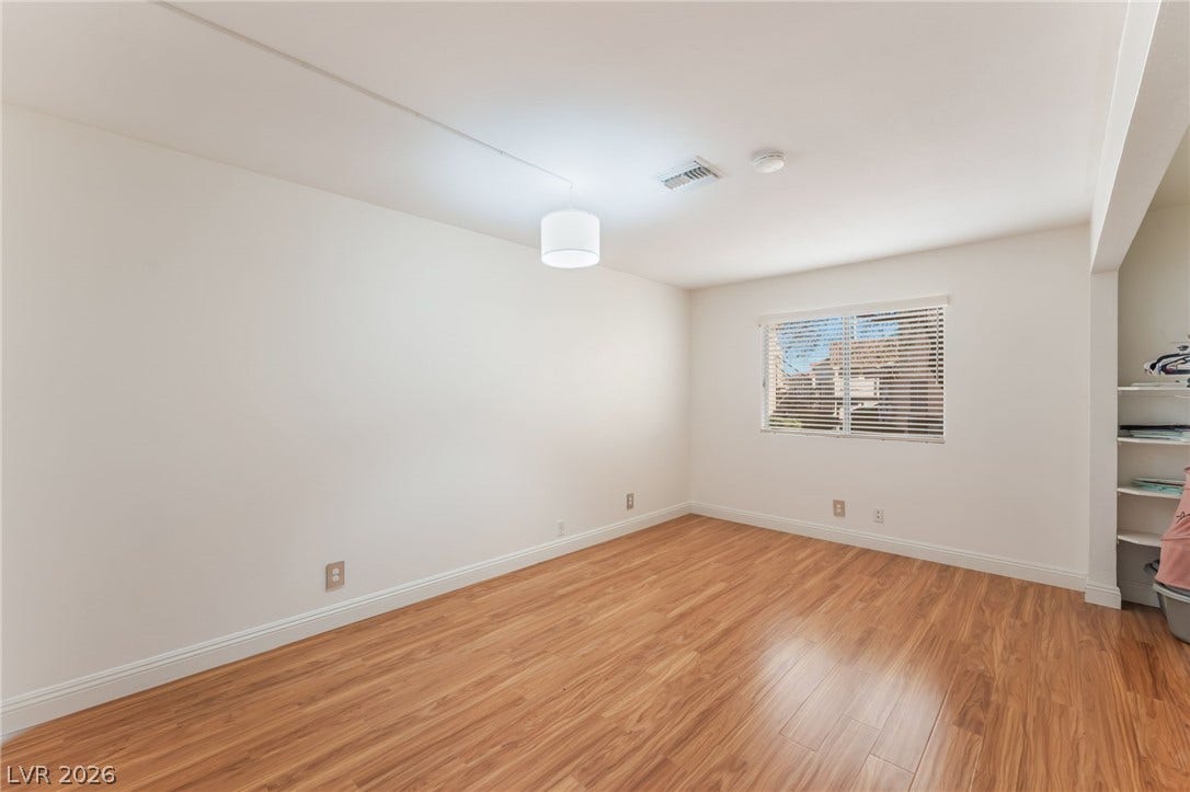 1305 Markwood Circle, #102, Las Vegas, NV 89128 Empty room with light wood-type flooring and baseboards