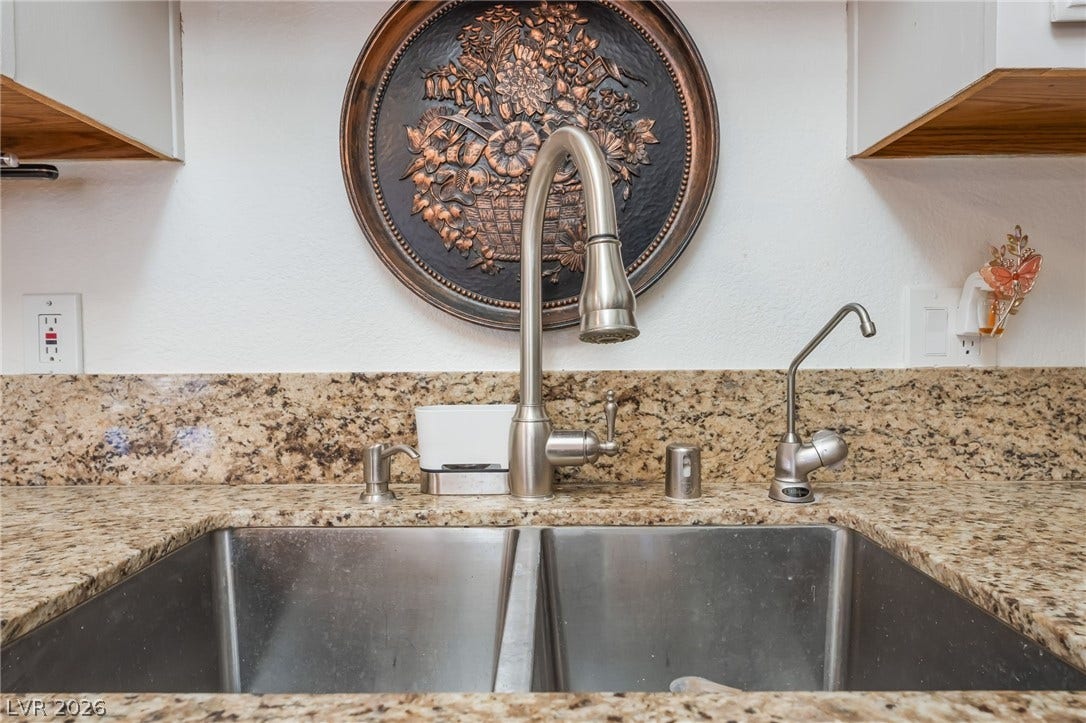 1305 Markwood Circle, #102, Las Vegas, NV 89128 Kitchen view of light stone countertops and a sink