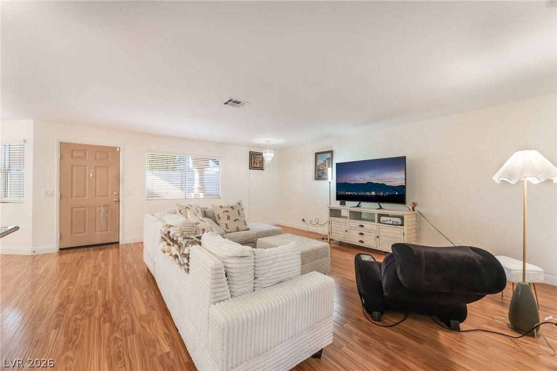 1305 Markwood Circle, #102, Las Vegas, NV 89128 Living area featuring light wood-style floors and baseboards