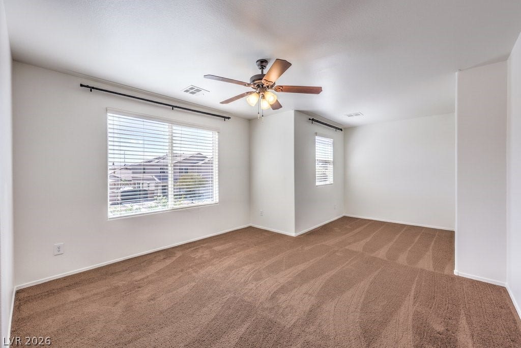 8132 Pink Desert Street, North Las Vegas, NV 89085 A quiet retreat with plush carpet and ample natural light from generously sized windows. This is the upstairs Loft. This is a great space to be used as you need.
