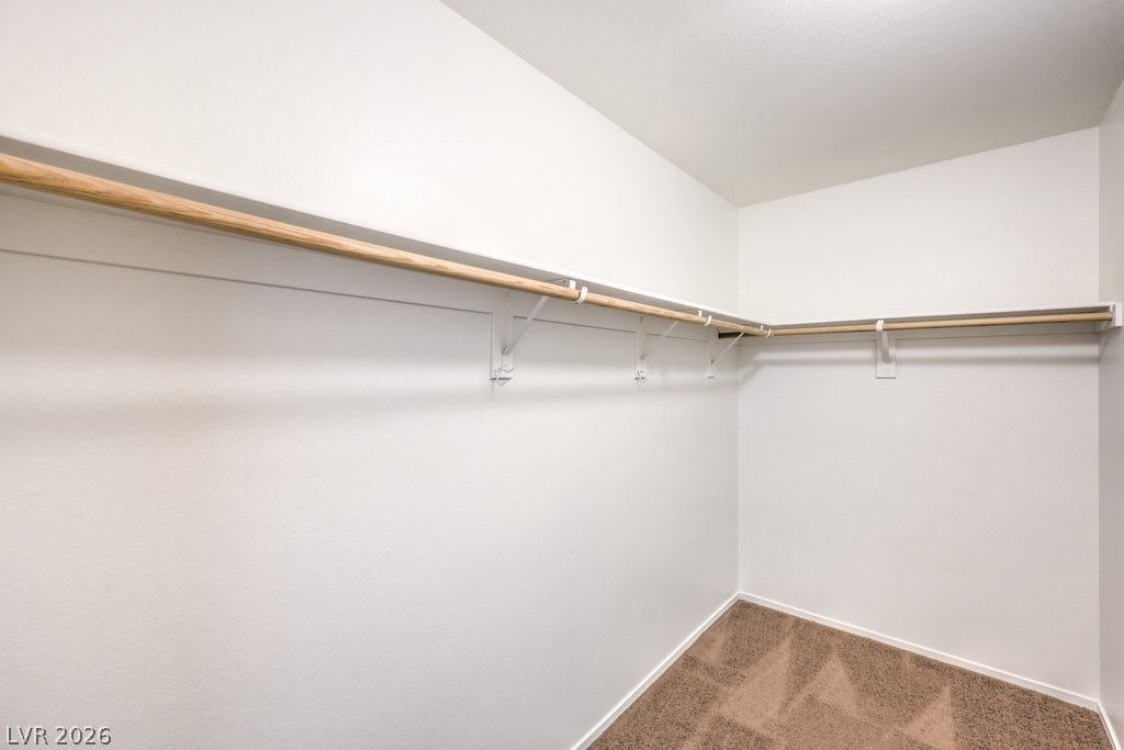 8132 Pink Desert Street, North Las Vegas, NV 89085 Ample hanging space and shelving create a well-organized walk-in closet for the upstairs bedroom.