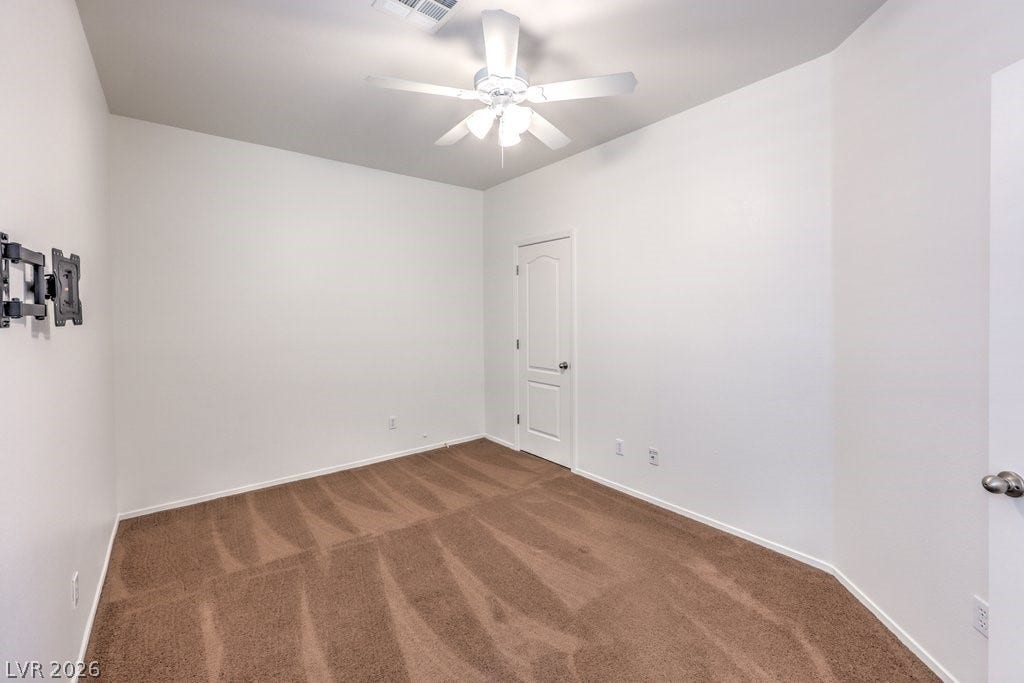 8132 Pink Desert Street, North Las Vegas, NV 89085 This spacious bedroom is located downstairs. There is a walk-In closet. Plus, there is a downstairs bathroom with a walk-in Shower.