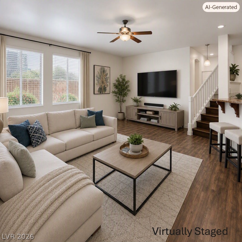 8132 Pink Desert Street, North Las Vegas, NV 89085 A well-lit living area offers abundant natural light and an open-concept flow to the adjacent staircase. This area has been Virtually Staged using AI and is for inspiration only.