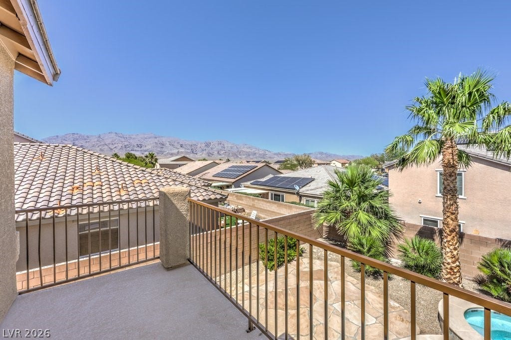 8132 Pink Desert Street, North Las Vegas, NV 89085 A private balcony provides captivating mountain vistas and views of the swimming pool.