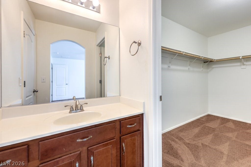 8132 Pink Desert Street, North Las Vegas, NV 89085 This bedroom offers a private sink that connects to a Jack & Jill type tub and toilet.