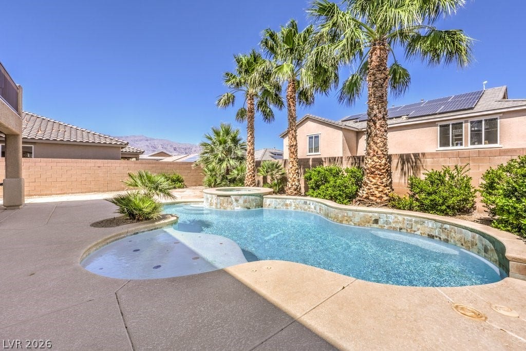 8132 Pink Desert Street, North Las Vegas, NV 89085 Beautiful pool offers a splash area or lounge area for chairs. Several sitting benches.