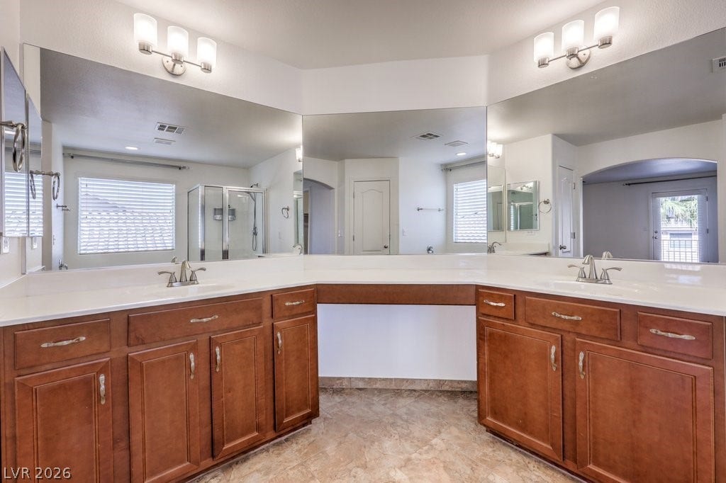 8132 Pink Desert Street, North Las Vegas, NV 89085 Ample counter space and dual sinks create a functional, well-appointed primary bath.