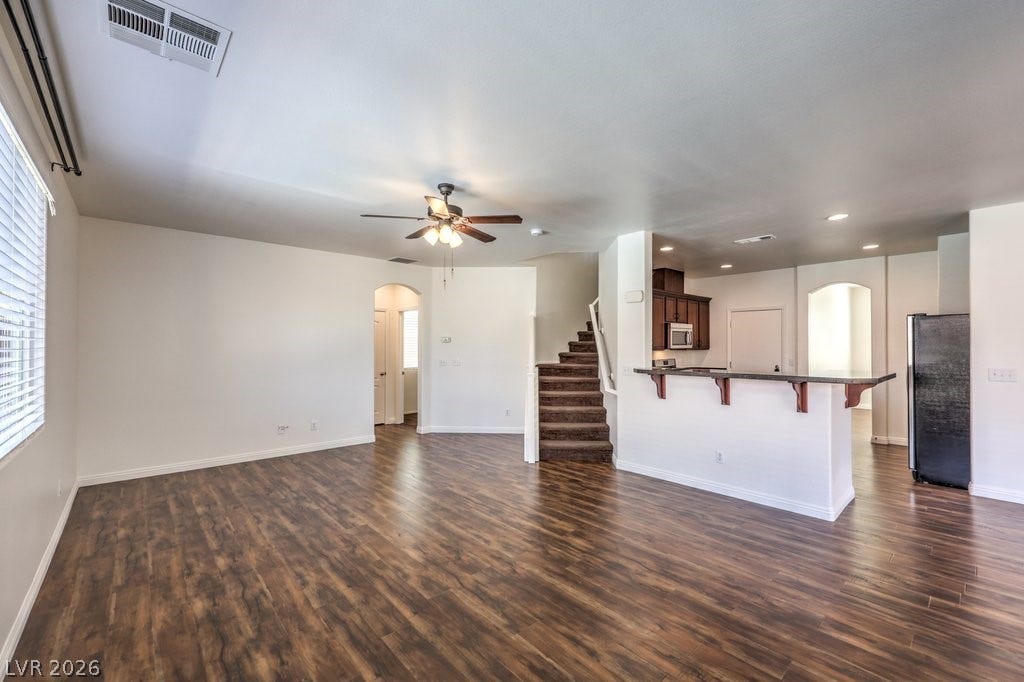 8132 Pink Desert Street, North Las Vegas, NV 89085 An inviting open-concept shows the staircase to the 2nd floor and the area for the downstairs bedroom.