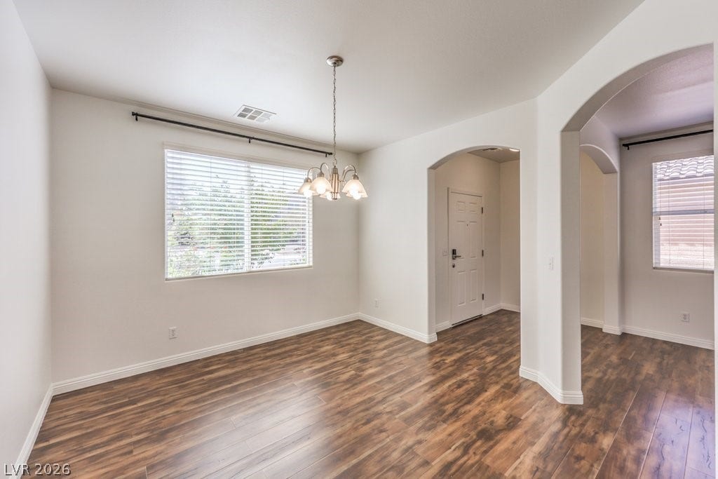 8132 Pink Desert Street, North Las Vegas, NV 89085 Rich hardwood-style flooring throughout the downstairs. Graceful archways define this adaptable interior space.