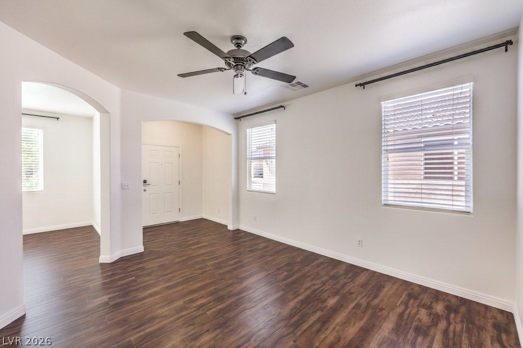 8132 Pink Desert Street, North Las Vegas, NV 89085 Rich wood flooring complements arched doorways in this inviting entry space. This area can be a sitting room or living room.