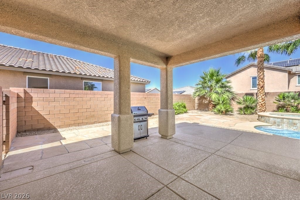 8132 Pink Desert Street, North Las Vegas, NV 89085 A spacious covered patio invites outdoor dining and relaxation by the private pool.