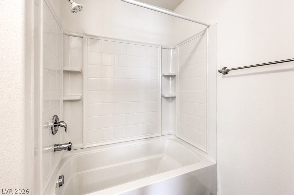 8132 Pink Desert Street, North Las Vegas, NV 89085 A well-maintained bathroom offering a standard shower-tub combination and a toilet.
