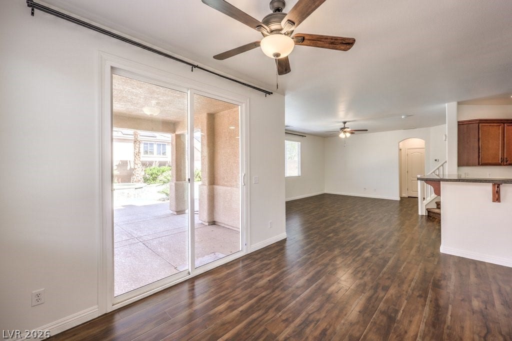 8132 Pink Desert Street, North Las Vegas, NV 89085 Sliding glass doors open to a spacious patio, offering abundant natural light and an inviting indoor-outdoor flow. Directly out to the swimming pool.