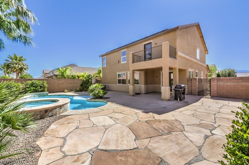 8132 Pink Desert Street, North Las Vegas, NV 89085 The patio offers an expansive flagstone area along with a Kool decking patio