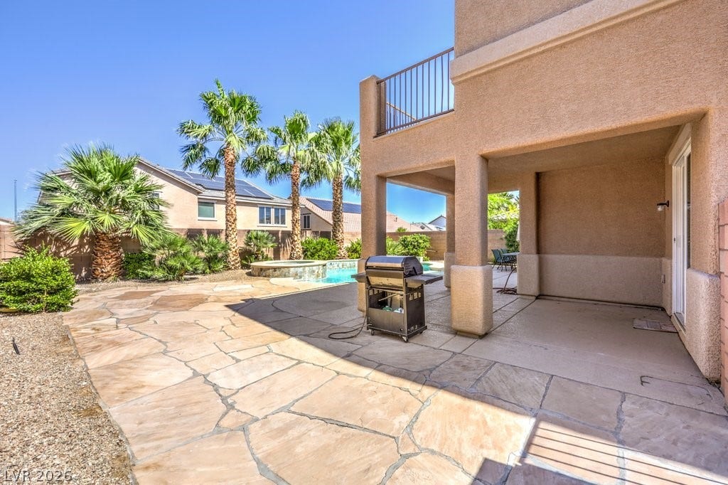 8132 Pink Desert Street, North Las Vegas, NV 89085 Entertain guests on the stone patio, cooled by the palm trees and a refreshing pool with a spillover spa will be a wonderful experience.