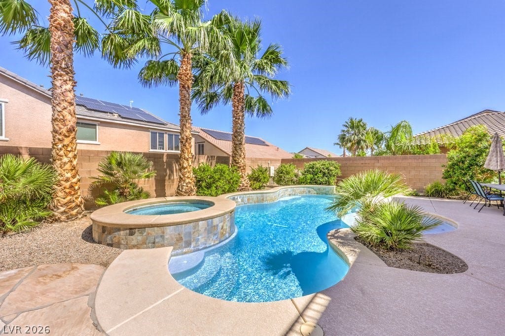 8132 Pink Desert Street, North Las Vegas, NV 89085 Escape to this private backyard oasis, featuring a curvilinear pool, adjacent spa, and easy to maintain desert landscaping.