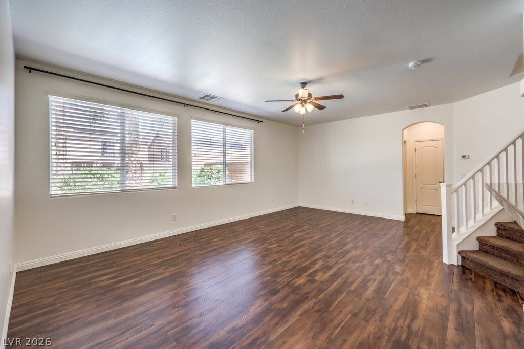 8132 Pink Desert Street, North Las Vegas, NV 89085 Natural light floods this inviting family-room space featuring resilient vinyl plank flooring and a ceiling fan for comfort. The sellers had a large sectional couch for movie night.