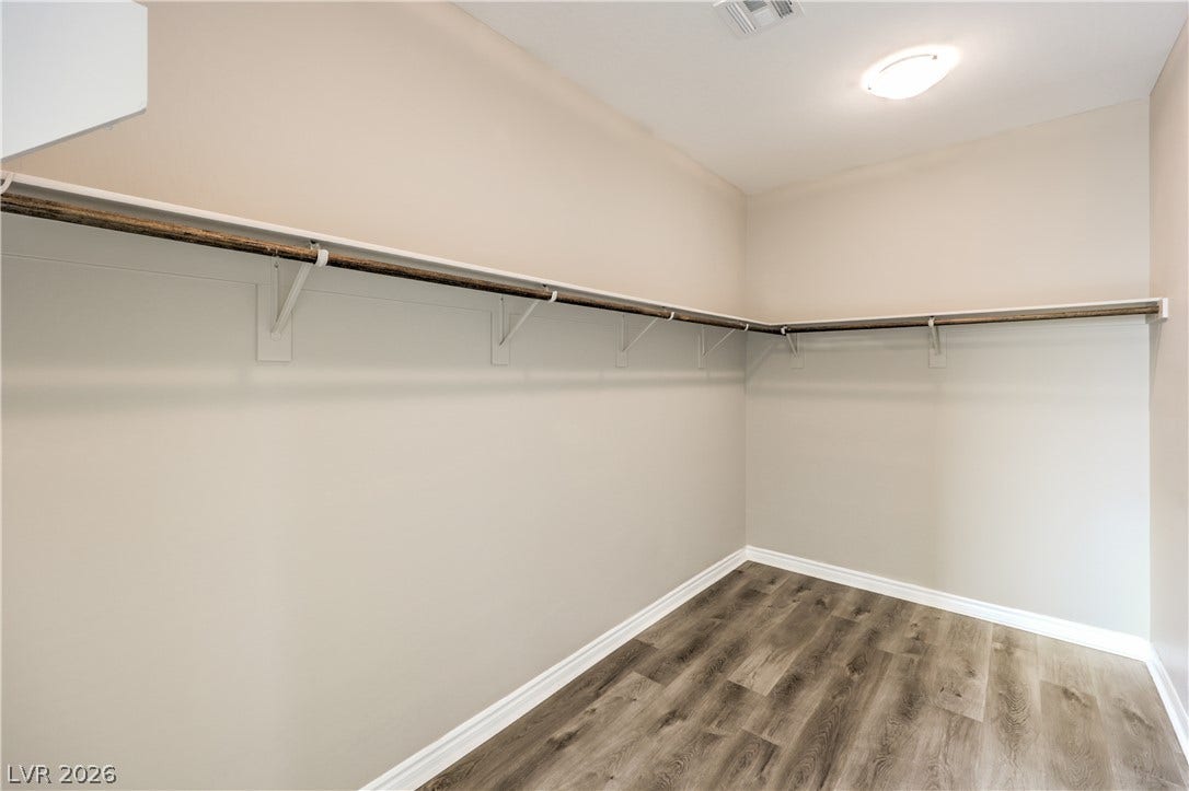 6934 Denio Island Street, North Las Vegas, NV 89084 Primary Bedroom, Generous storage space in this walk-in closet .