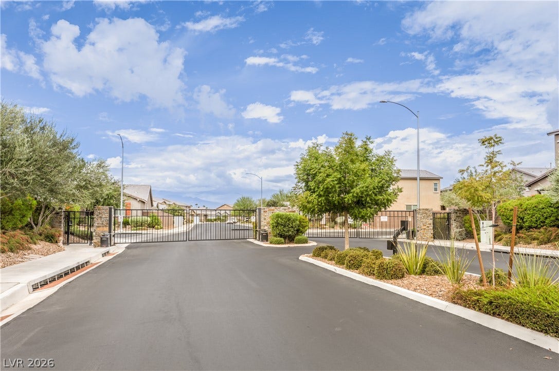 6934 Denio Island Street, North Las Vegas, NV 89084 An elegant gated entry with professional landscaping welcomes residents to this private neighborhood.