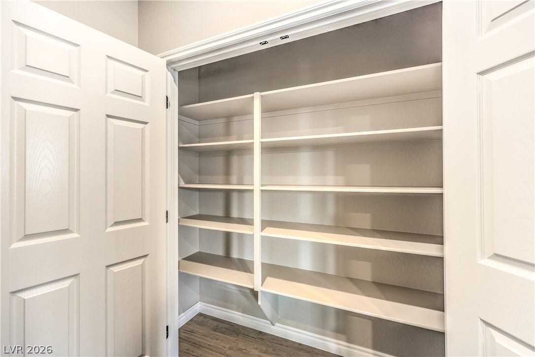 6934 Denio Island Street, North Las Vegas, NV 89084 Generous built-in shelving maximizes storage potential inside this clean pantry space.