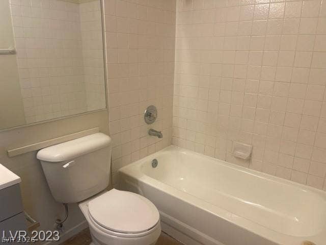 A classic bathtub and tiled surround offer potential for personalization.
