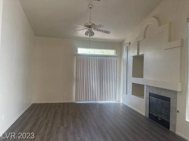 An architectural fireplace wall anchors this spacious living area with sliding doors.