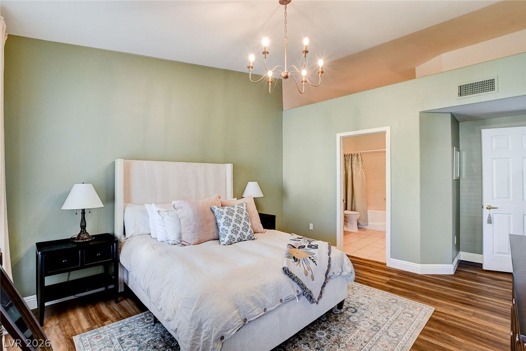 1520 Ruby Cliffs Lane, #203, Las Vegas, NV 89144 Vaulted ceilings and handsome wood flooring define this comfortable bedroom suite with an adjoining bath.