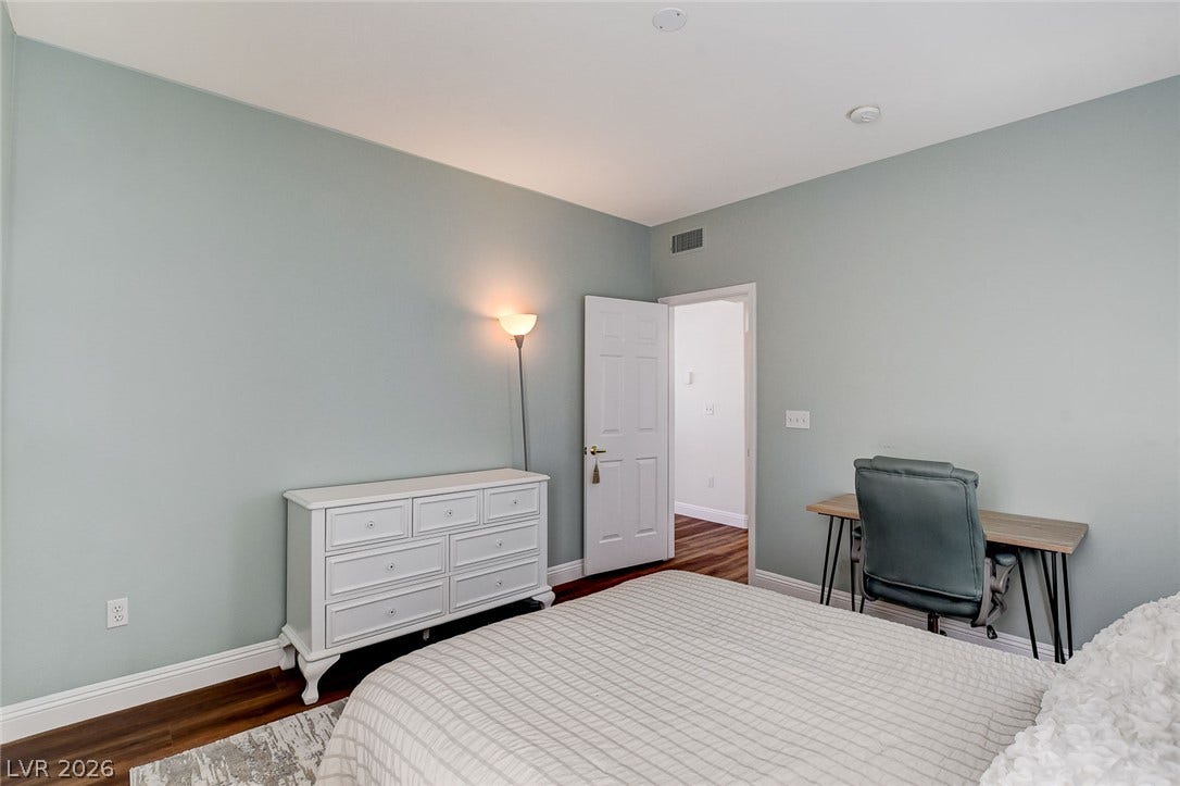 1520 Ruby Cliffs Lane, #203, Las Vegas, NV 89144 Rich wood-toned flooring contrasts beautifully against crisp baseboards and smooth walls.