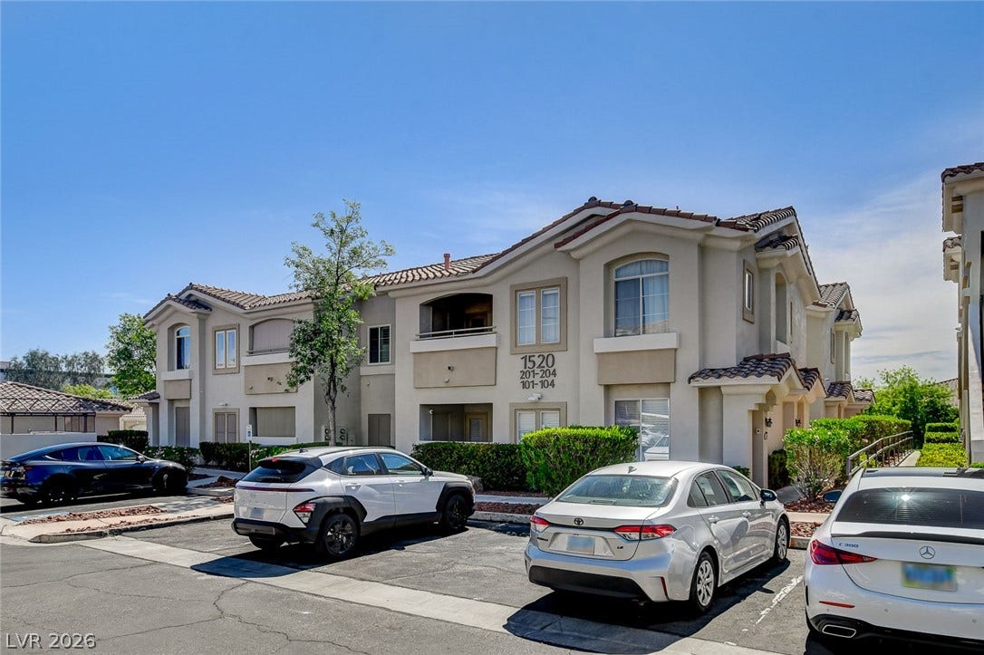 1520 Ruby Cliffs Lane, #203, Las Vegas, NV 89144 Spanish tile roofs and stucco exteriors define this classic multi-level residential building.