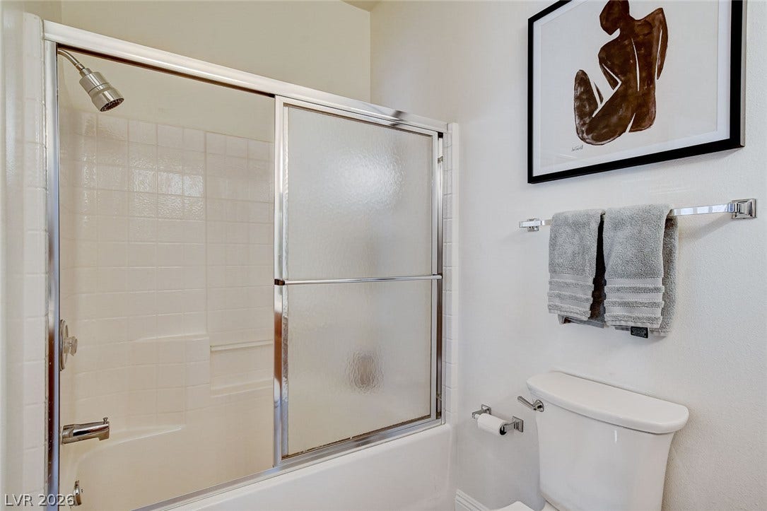 1520 Ruby Cliffs Lane, #203, Las Vegas, NV 89144 Clean lines and classic tiling define this well-appointed bathroom space.