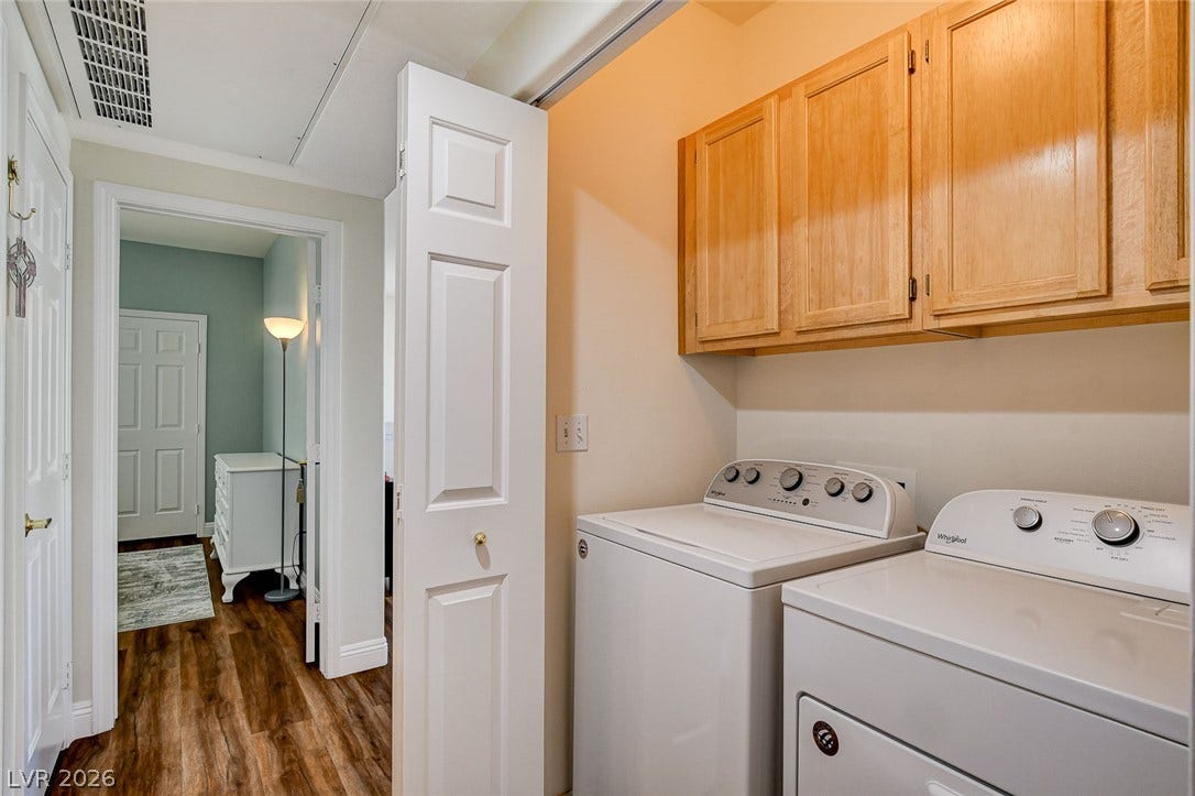 1520 Ruby Cliffs Lane, #203, Las Vegas, NV 89144 Functional utility space features wood cabinetry and durable flooring near the adjoining rooms.